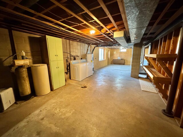 34257 Dusty Trl, Frazee, MN 56544 - basement featuring a water softener, washing machine and dryer, and stairway