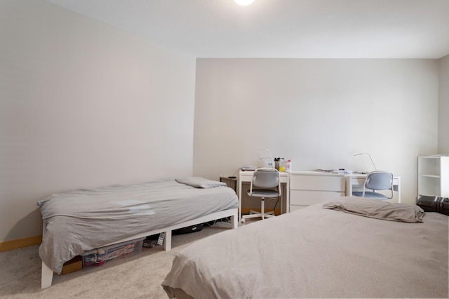 carpeted bedroom with baseboards