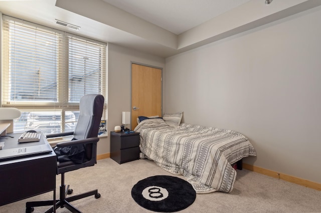 carpeted bedroom with baseboards and visible vents