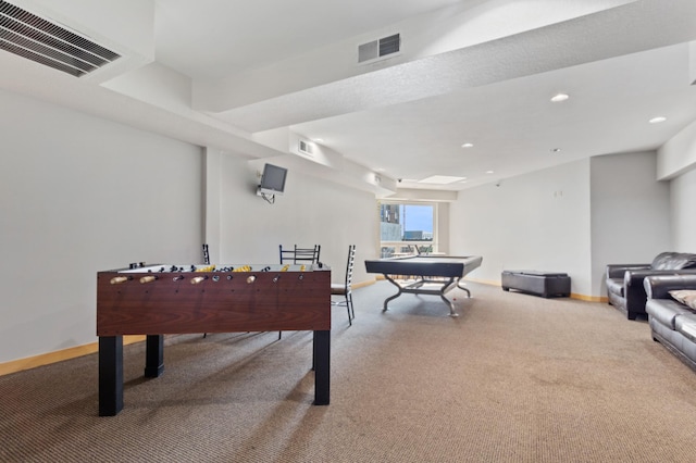 recreation room featuring carpet, visible vents, and baseboards