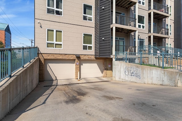 exterior space featuring a garage and concrete driveway