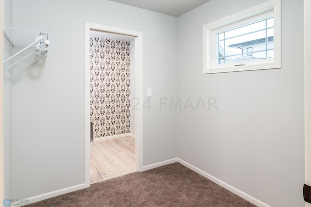 interior space featuring dark colored carpet