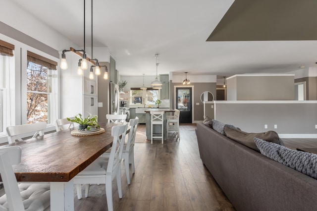 dining area featuring dark wood finished floors