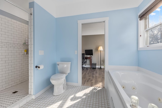 bathroom featuring toilet, a shower stall, a jetted tub, and tile patterned flooring