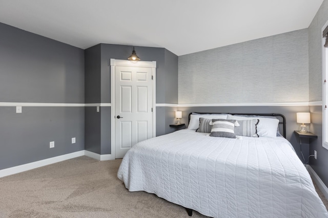 carpeted bedroom featuring baseboards