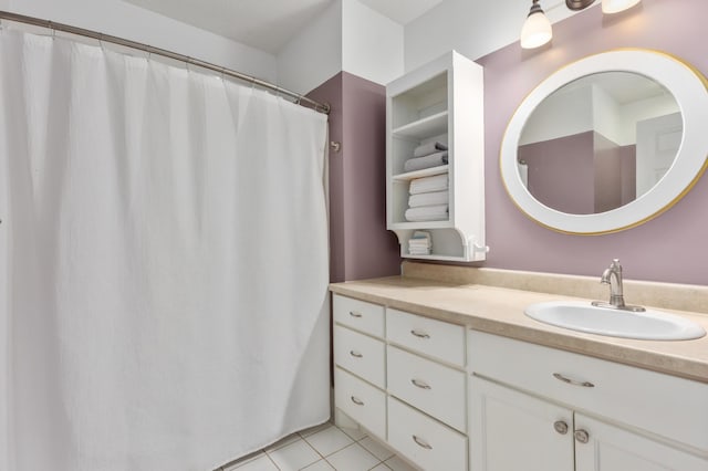 full bath with tile patterned flooring and vanity