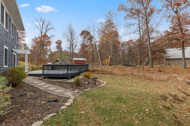 view of yard with a wooden deck