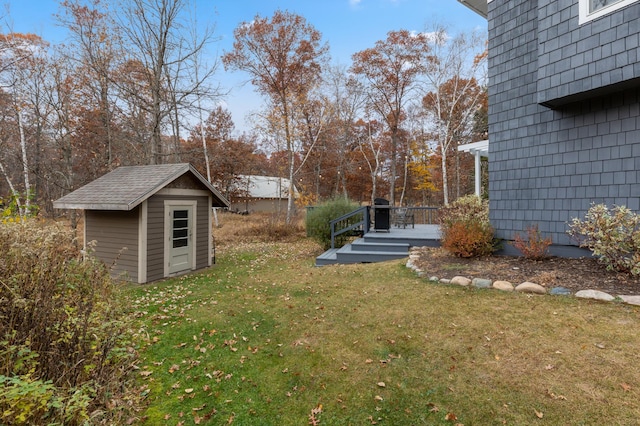 view of yard with a storage shed and an outdoor structure