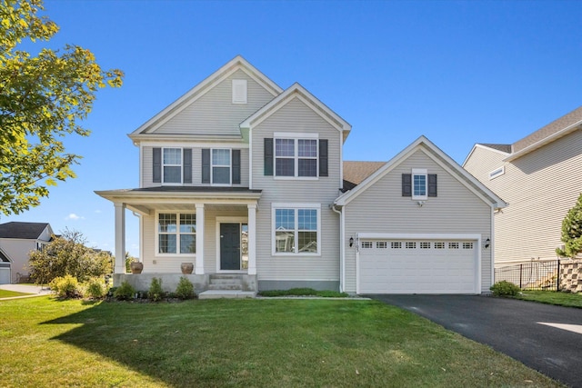 view of front of property featuring aphalt driveway and a front lawn