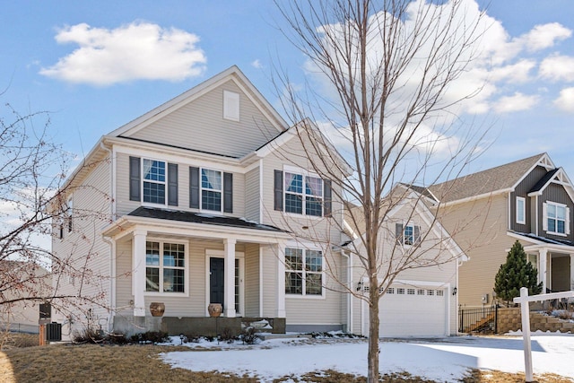 view of front facade with a porch, central AC unit, an attached garage, and fence