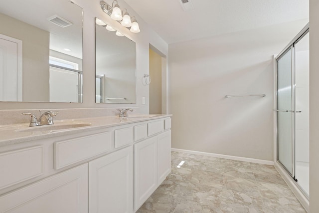 bathroom featuring a shower stall, visible vents, and a sink