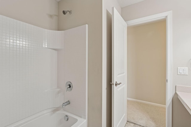 full bath featuring washtub / shower combination, vanity, and baseboards