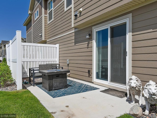 view of patio featuring a fire pit