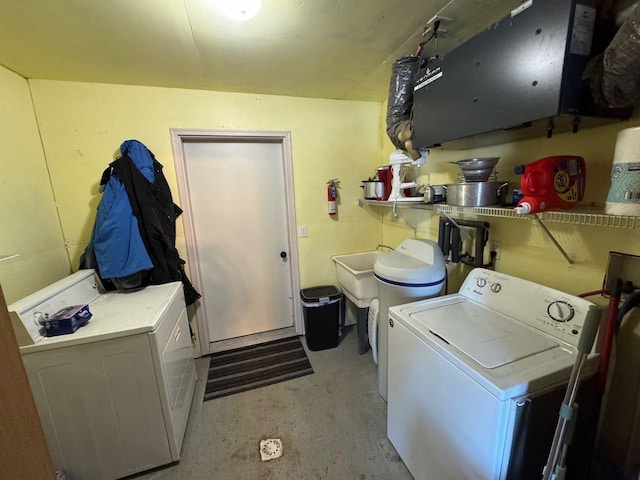 laundry area with laundry area and washer and clothes dryer