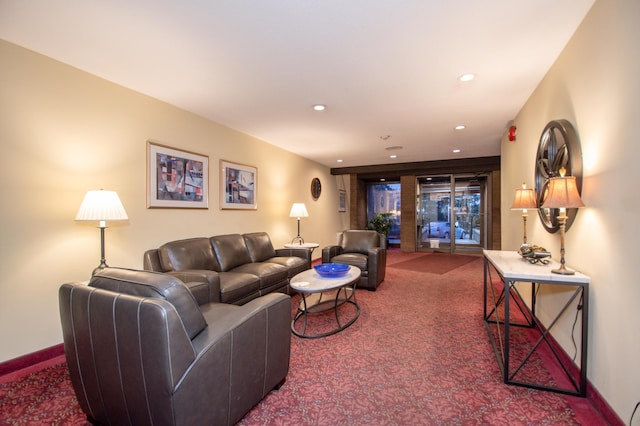 living area featuring baseboards, carpet, and recessed lighting