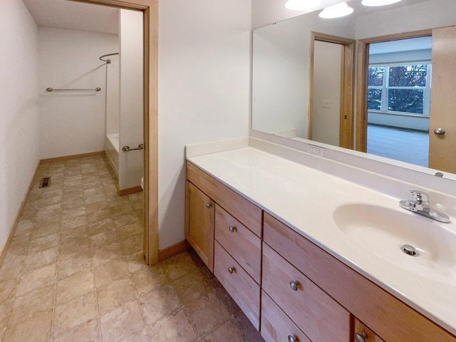 full bathroom featuring visible vents, vanity, and baseboards