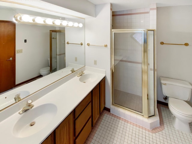 full bathroom featuring tile patterned flooring, a sink, toilet, and a shower stall