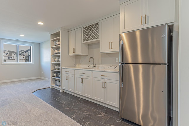 kitchen featuring recessed lighting, baseboards, light countertops, freestanding refrigerator, and open shelves