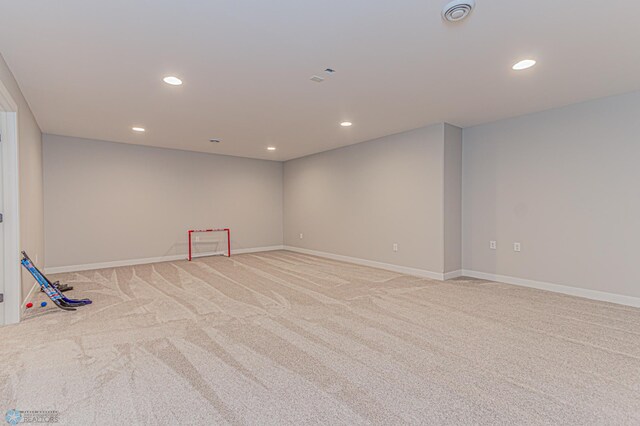 spare room featuring recessed lighting, visible vents, baseboards, and light colored carpet