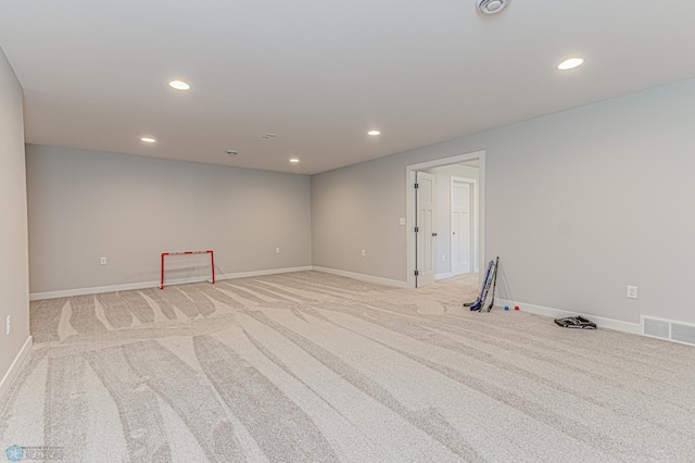 empty room with light carpet, baseboards, visible vents, and recessed lighting