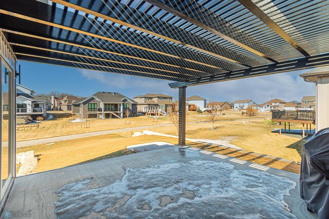 view of patio / terrace with a residential view and a pergola