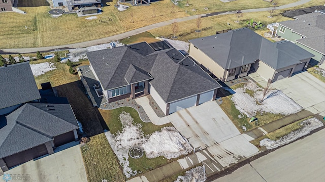 birds eye view of property with a residential view