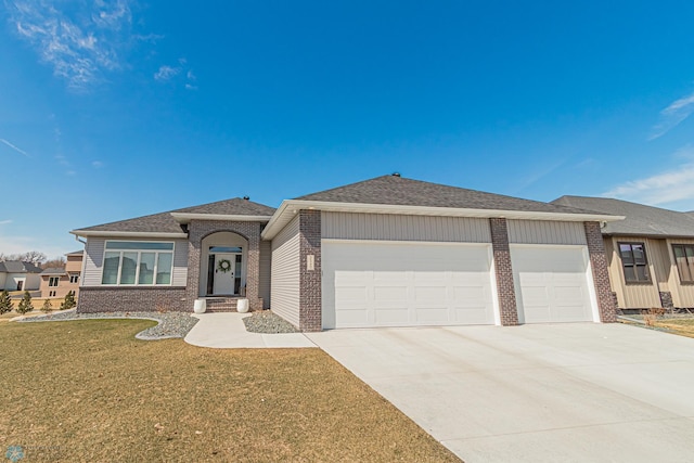 view of front of house featuring a front yard, brick siding, concrete driveway, an attached garage, and a shingled roof
