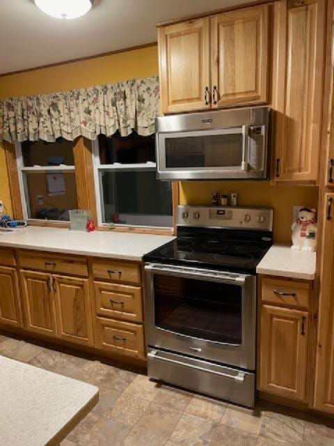 kitchen with stainless steel appliances and light countertops