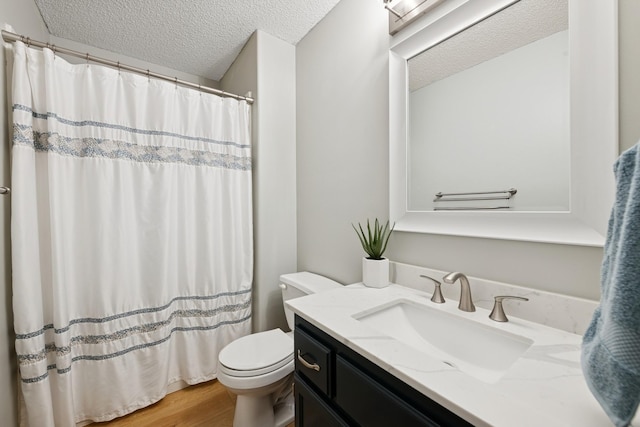4514 Mcallister Ave NE, Saint Michael, MN 55376 - bathroom featuring toilet, a textured ceiling, vanity, wood finished floors, and a shower with shower curtain