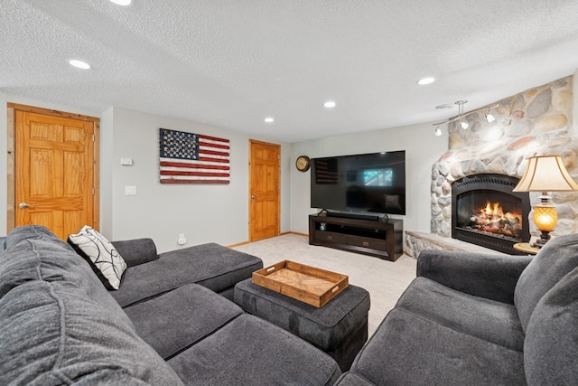 4514 Mcallister Ave NE, Saint Michael, MN 55376 - living area with a textured ceiling, carpet flooring, a fireplace, and recessed lighting