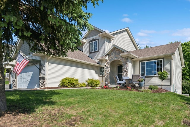 4514 Mcallister Ave NE, Saint Michael, MN 55376 - view of front of property with a front lawn, a shingled roof, stone siding, and an attached garage