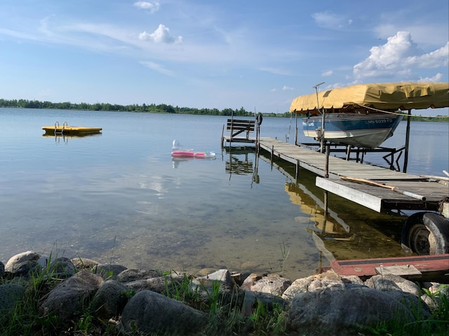 dock area featuring a water view and boat lift