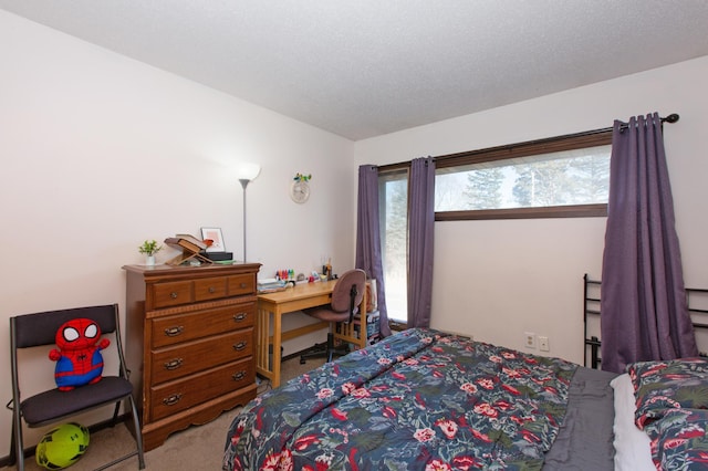 carpeted bedroom featuring a textured ceiling