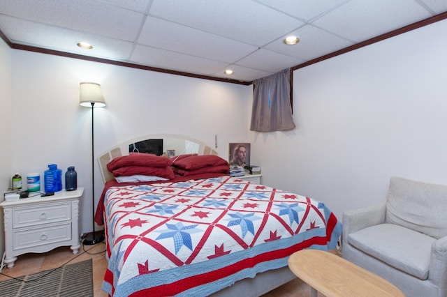 bedroom with a paneled ceiling and recessed lighting