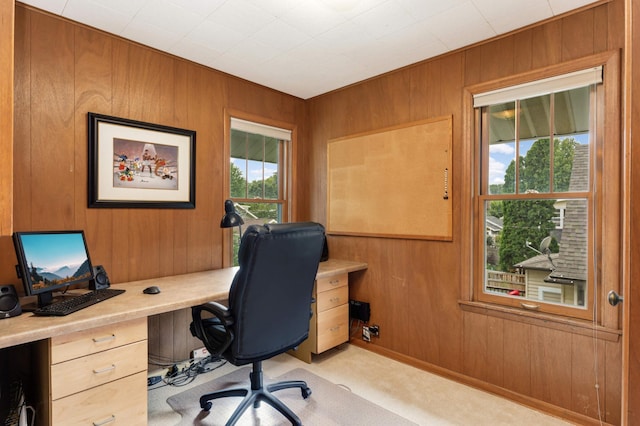 carpeted office with wooden walls