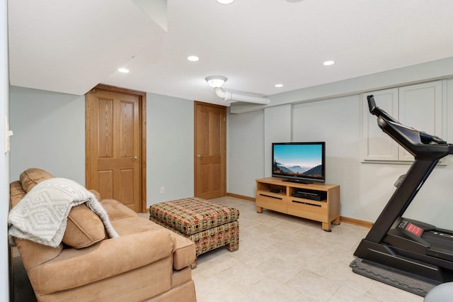 living area with recessed lighting and baseboards