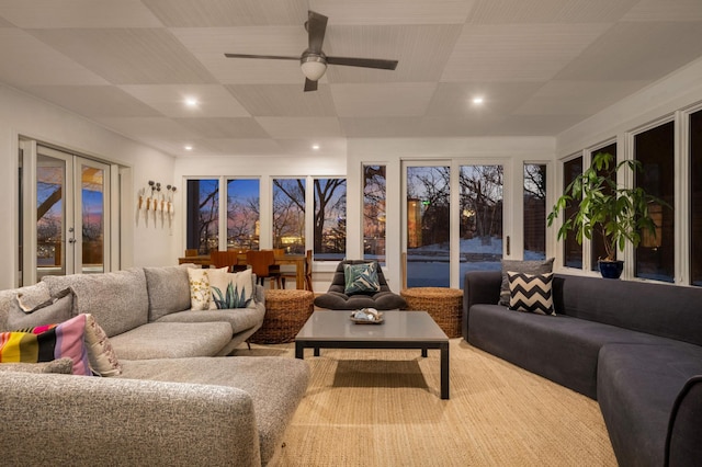 sunroom / solarium with french doors and ceiling fan