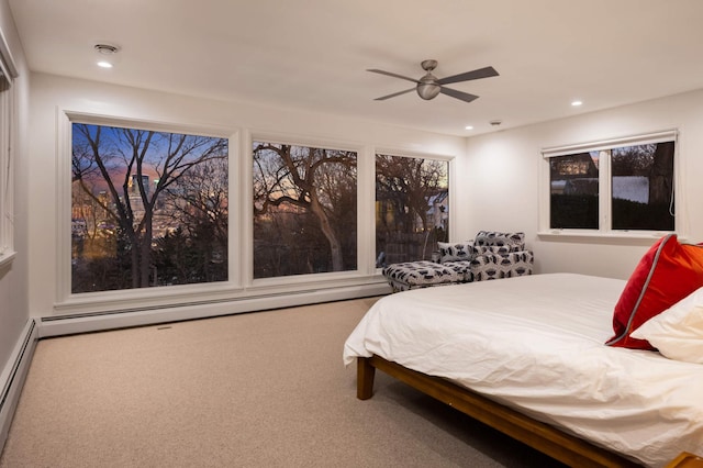 bedroom with carpet floors, a baseboard radiator, baseboard heating, and recessed lighting