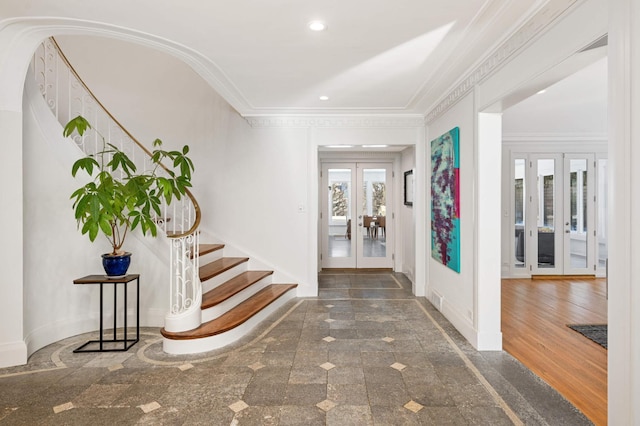 entryway featuring ornamental molding, french doors, stairs, and baseboards