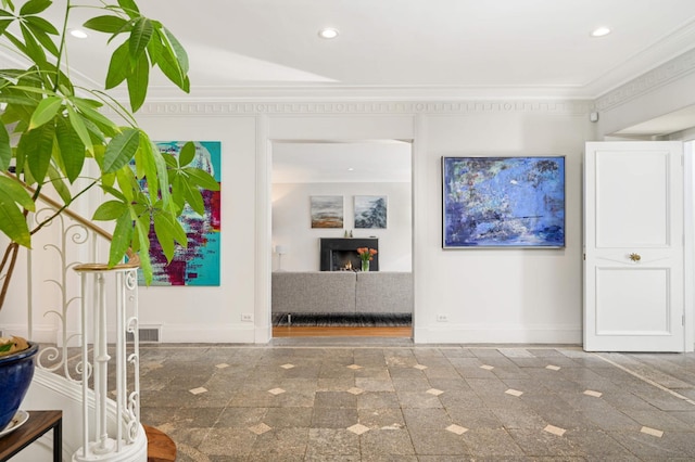 hallway featuring recessed lighting, crown molding, baseboards, and granite finish floor