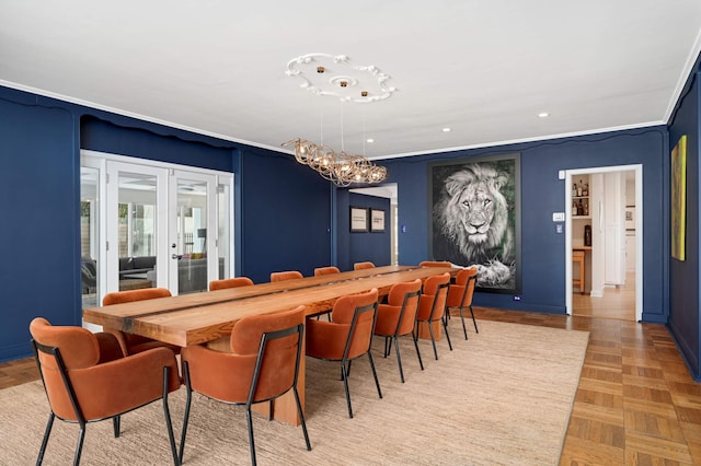 dining space with a notable chandelier, recessed lighting, crown molding, and french doors