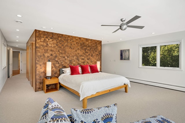 bedroom with recessed lighting, an accent wall, a ceiling fan, baseboard heating, and carpet