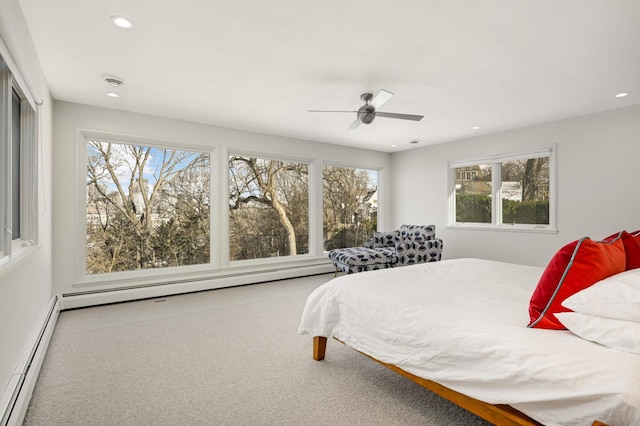 bedroom featuring carpet, ceiling fan, a baseboard radiator, and recessed lighting