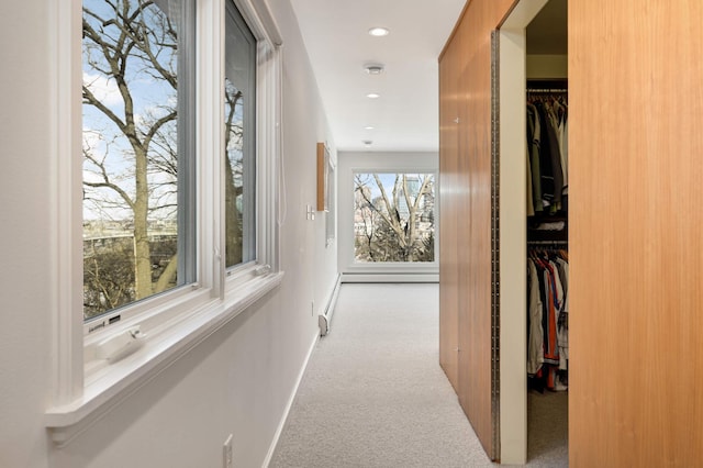 hall featuring carpet, baseboards, and recessed lighting