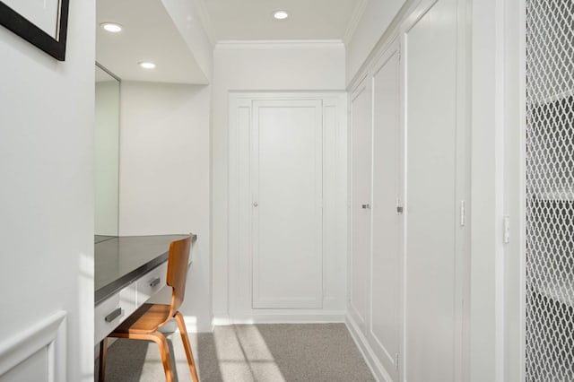 hall featuring recessed lighting, crown molding, and carpet