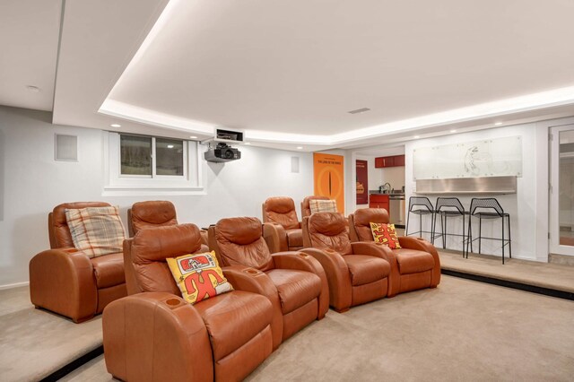 cinema room with recessed lighting, baseboards, a sink, and light colored carpet