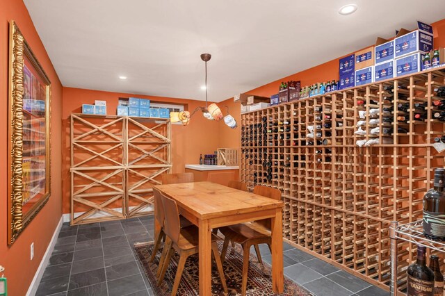 wine room featuring recessed lighting and baseboards