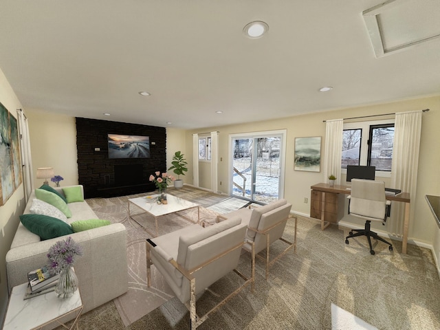 carpeted living room with baseboards, recessed lighting, attic access, and a healthy amount of sunlight