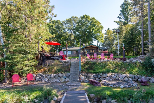 view of yard with stairway and a wooden deck