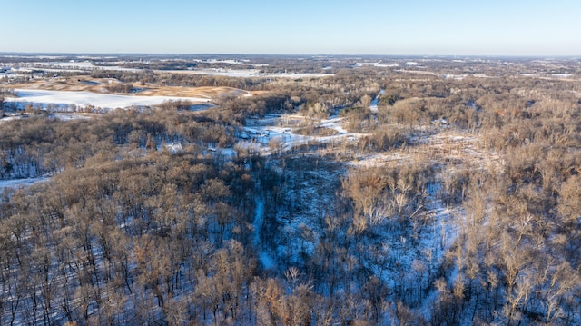 drone / aerial view featuring a forest view